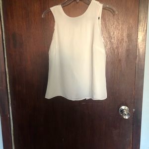 Sleeveless white summer blouse
